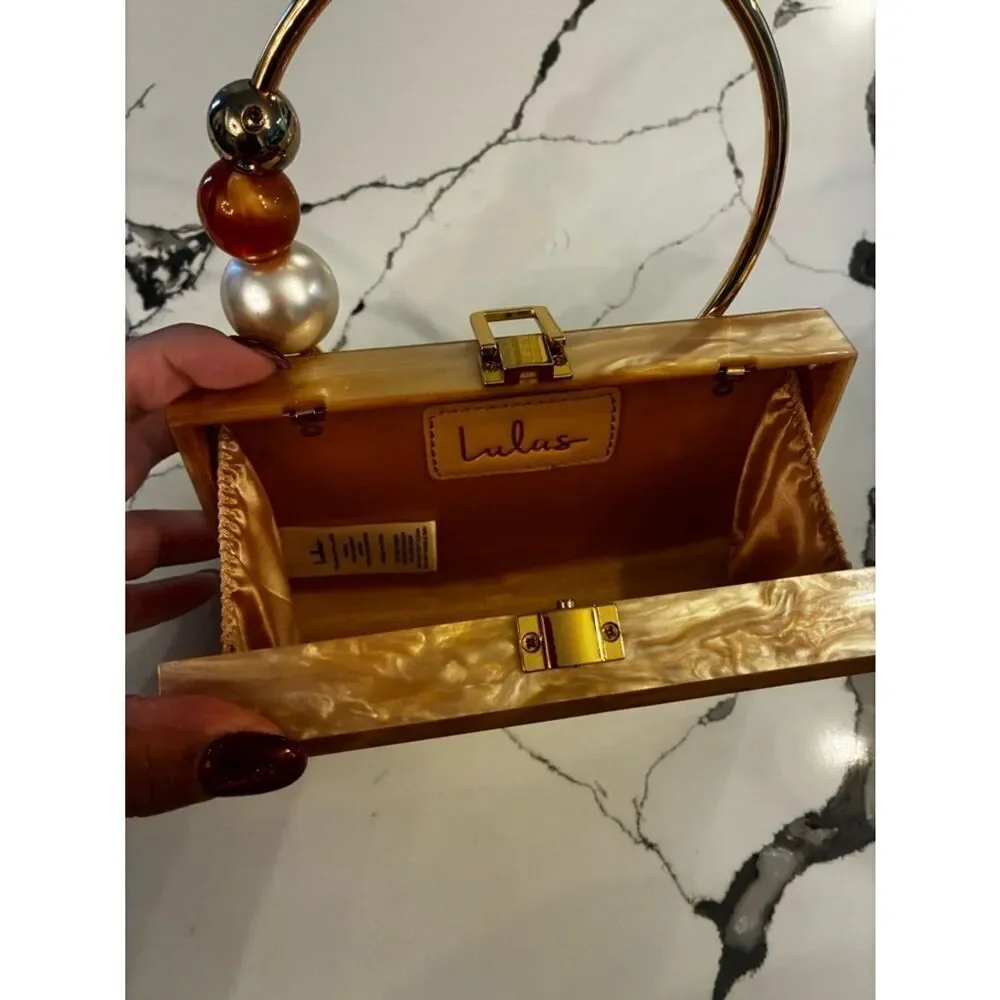 Lulu's Pearlescent Pink Acrylic Box Clutch with Gold Ring Handle